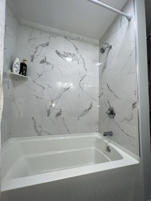 Combined shower/tub, hair dryer, towels, soap