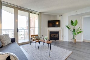 City Apartment | Living room | 38-inch Smart TV with cable channels, TV, fireplace