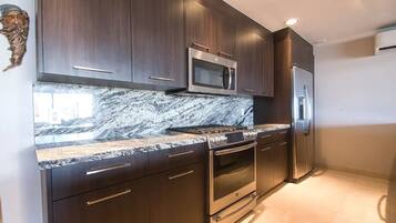 Comfort Condo | Private kitchenette | Fridge, cookware/dishes/utensils