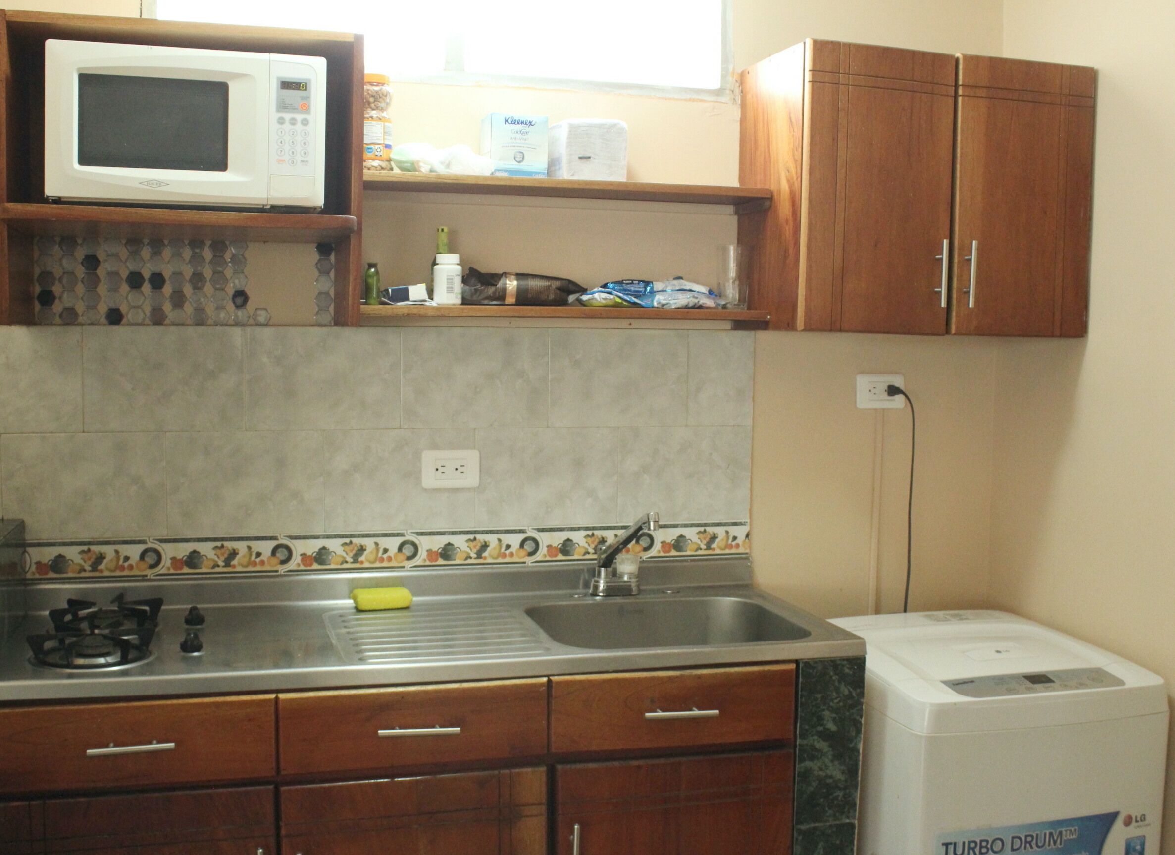 Fridge, microwave, cookware/dishes/utensils, dining tables