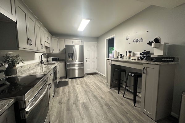Fully stocked kitchen and coffee bar.