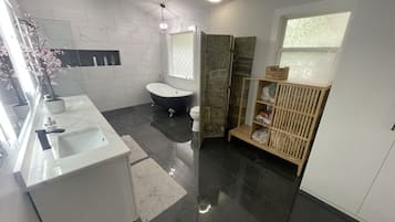 Bathtub, hair dryer, towels, soap