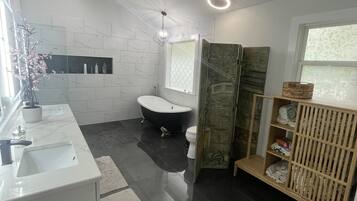 Bathtub, hair dryer, towels, soap