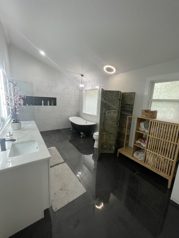 Bathtub, hair dryer, towels, soap