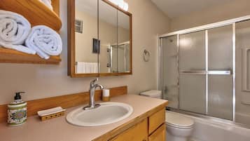 Bathtub, hair dryer, towels, soap