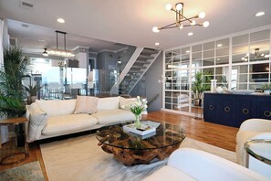 Relax in this stylish living room with a sofa, coffee table, and decorative touches.