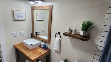 Combined shower/tub, hair dryer, towels, soap