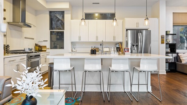 A modern kitchen with white cabinets, stainless steel appliances, and a central island with bar stools. - ★Insta-Worthy Sunset View ★Private Rooftop ★Garage ★Silver Lake ★Dodgers Stadium (Los Angeles)