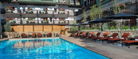 A heated pool, pool loungers