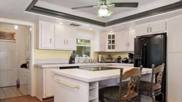 Romantic Suite, 1 King Bed, River View | Private kitchen | Mini-fridge