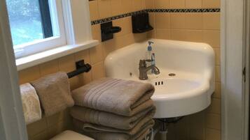 Combined shower/tub, hair dryer, towels, soap