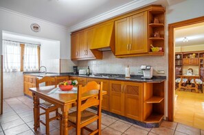 Microwave, toaster, highchair, dining tables