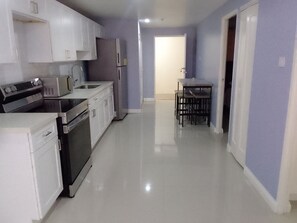 Fridge, microwave, oven, stovetop - Bayfront Budget Friendly 2 Bedrooms and 2 Bathrooms Apt in Gated Community (Portmore)