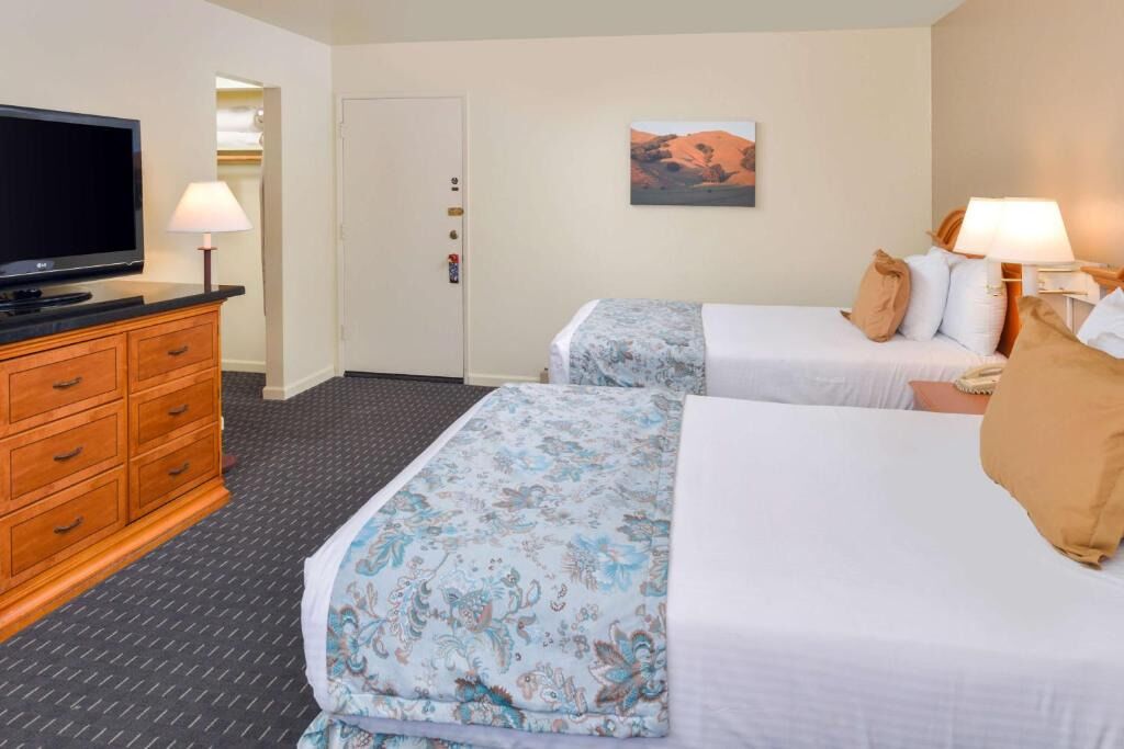 Stretch out with plenty of space, dresser storage, and big TV.