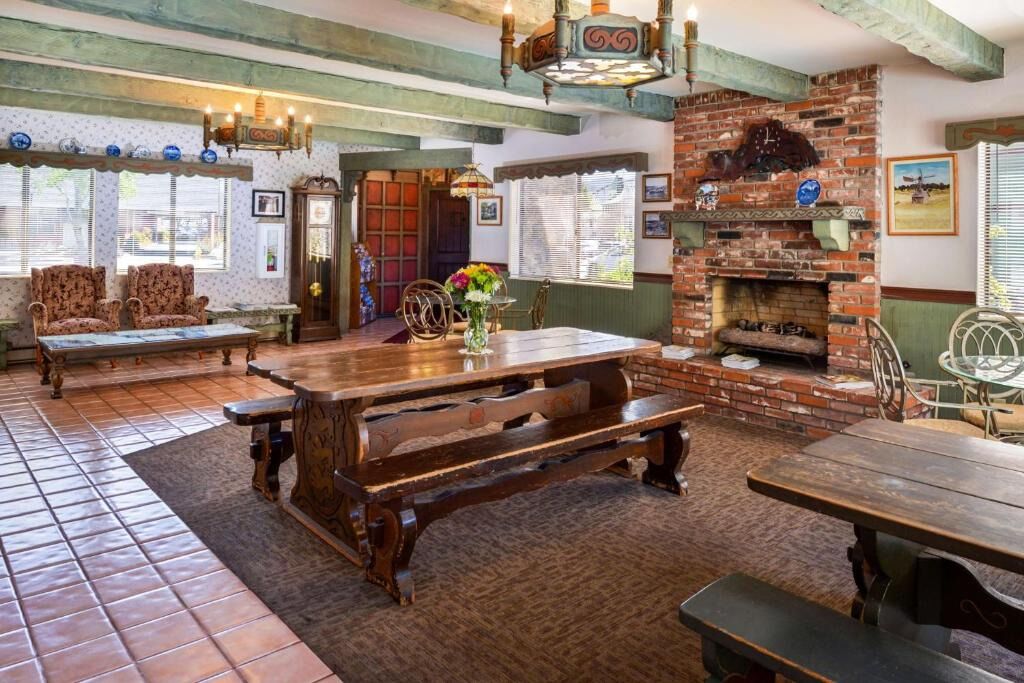 Gather by the warm fireplace in a charming, rustic lounge.