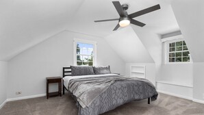 A bedroom with a sloped ceiling, a bed, a nightstand, and a ceiling fan. - Home with amazing location, 25min to Wintergreen, 30 min to Charlottesville, 20 min Staunton (Waynesboro)