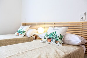 4 slaapkamers, een strijkplank/strijkijzer, beddengoed