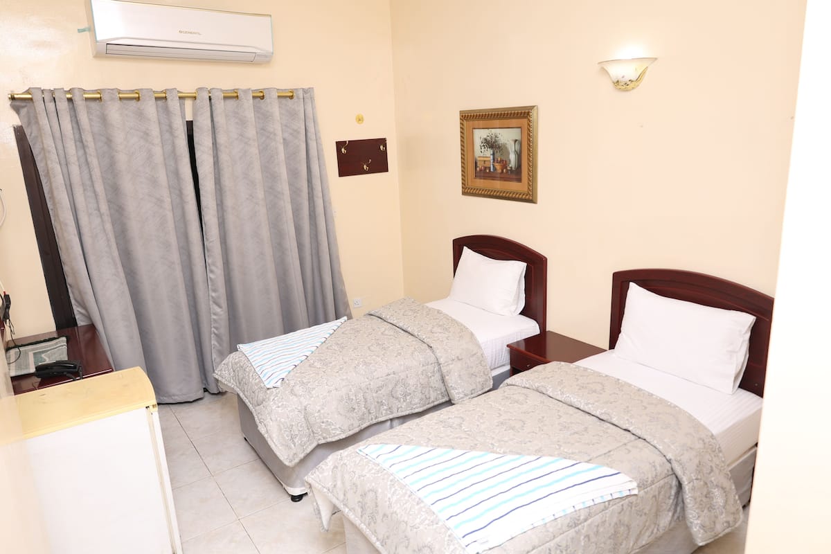 Habitación básica con 2 camas individuales | Wifi gratis