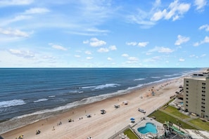 On the beach - Stay in this updated 3BR/3BA ocean-view condo on the 14th floor in Daytona Beach Shores. Enjoy panoramic ocean views, direct beach access, a heated pool, spa, saunas, library, and nearby restaurants, shops, and Daytona International Speedway. (Daytona Beach Shores)