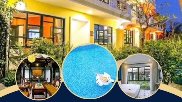 A two-story hotel with a yellow facade, balconies, and a swimming pool. - Sunshine Villa Hoi An (Da Nang)