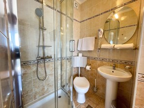 Shower, towels, toilet paper