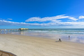 Walk along the beach and enjoy the calm waters.