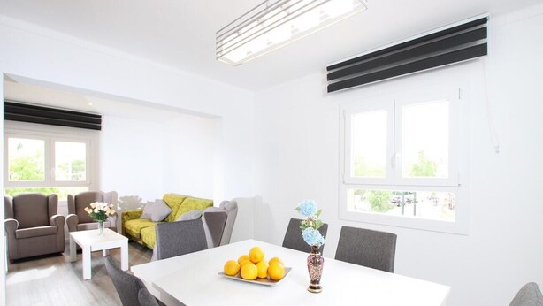 A modern living room with a dining table, sofas, and a coffee table. - Holiday Apartment "Rieres" with Terrace & Wi-Fi (PORT POLLENÇA)