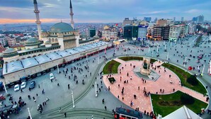 A large public square with a mosque, a central monument, and surrounding modern buildings. - Taksim Miran Suit (Istanbul)