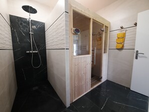 Shower, hair dryer, towels, soap