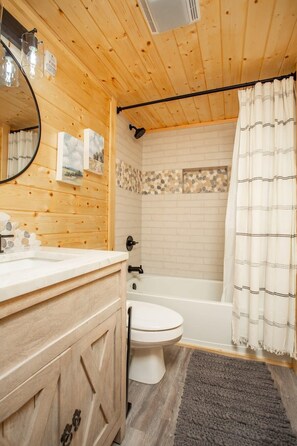 Bathtub, hair dryer, towels
