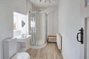 Bathtub, hair dryer, towels, soap