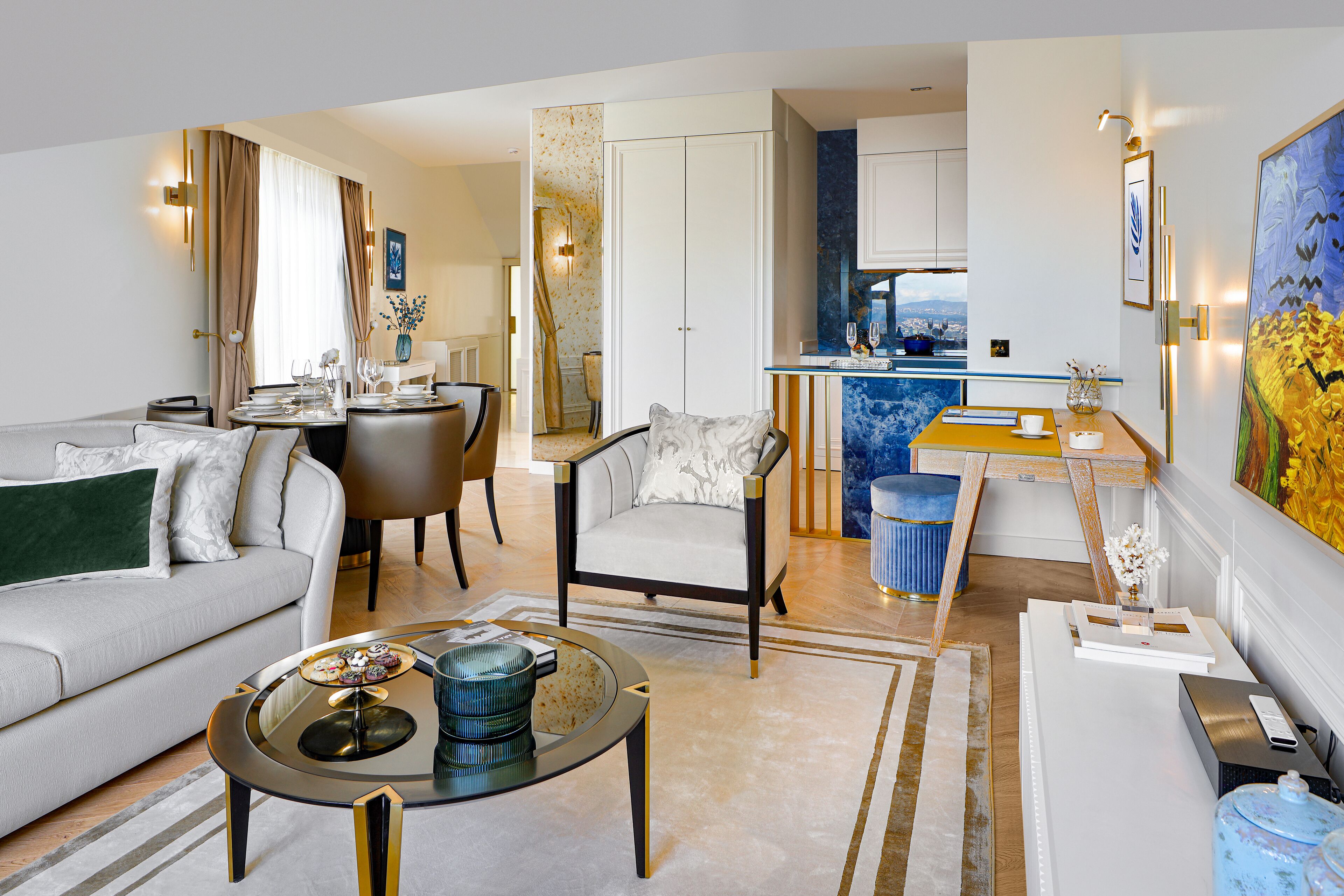 A modern living room with a sofa, coffee table, and a dining area with chairs and a table set for two.