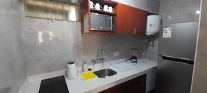 Fridge, microwave, coffee/tea maker, electric kettle