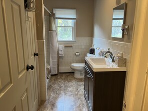 Combined shower/tub, hair dryer, towels, soap