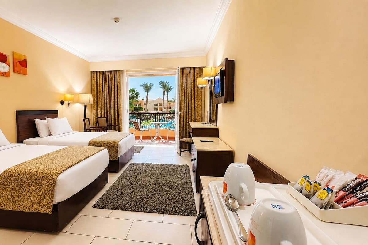 Deluxe Pool View | Hypo-allergenic bedding, down duvets, minibar, in-room safe