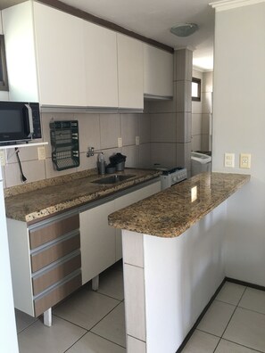 Fridge, microwave, stovetop, cookware/dishes/utensils