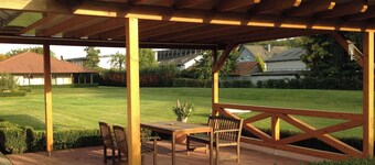 Spacious vacation apartment with a beautiful covered terrace in a huge garden.