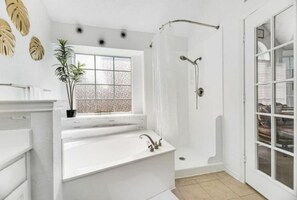 Combined shower/tub, hair dryer, towels, soap