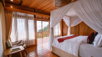 A bedroom with a wooden ceiling, a canopy bed, and a view of a balcony.