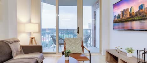 Comfort Apartment, 1 Bedroom, City View | Living area | 50-inch Smart TV with cable channels, TV