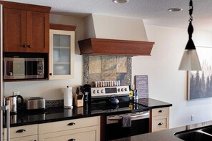 Fridge, coffee/tea maker, cookware/dishes/utensils