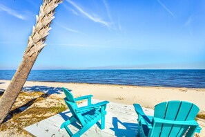 On the beach, sun loungers, beach towels