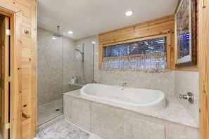 Bathtub, jetted tub, hair dryer, towels
