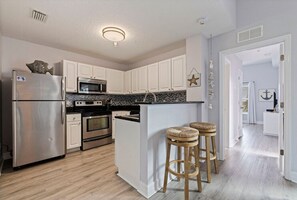 Fridge, microwave, oven, stovetop - Lovely Water View Condo, Top Floor, Steps to Beach (Madeira Beach)