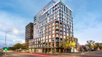 Situated at a street corner, this building offers a unique urban experience.