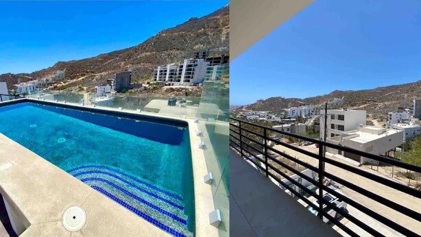 Una piscina en la azotea con vistas despejadas a los edificios y montañas circundantes.