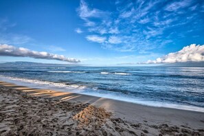 On the beach, sun-loungers, beach towels