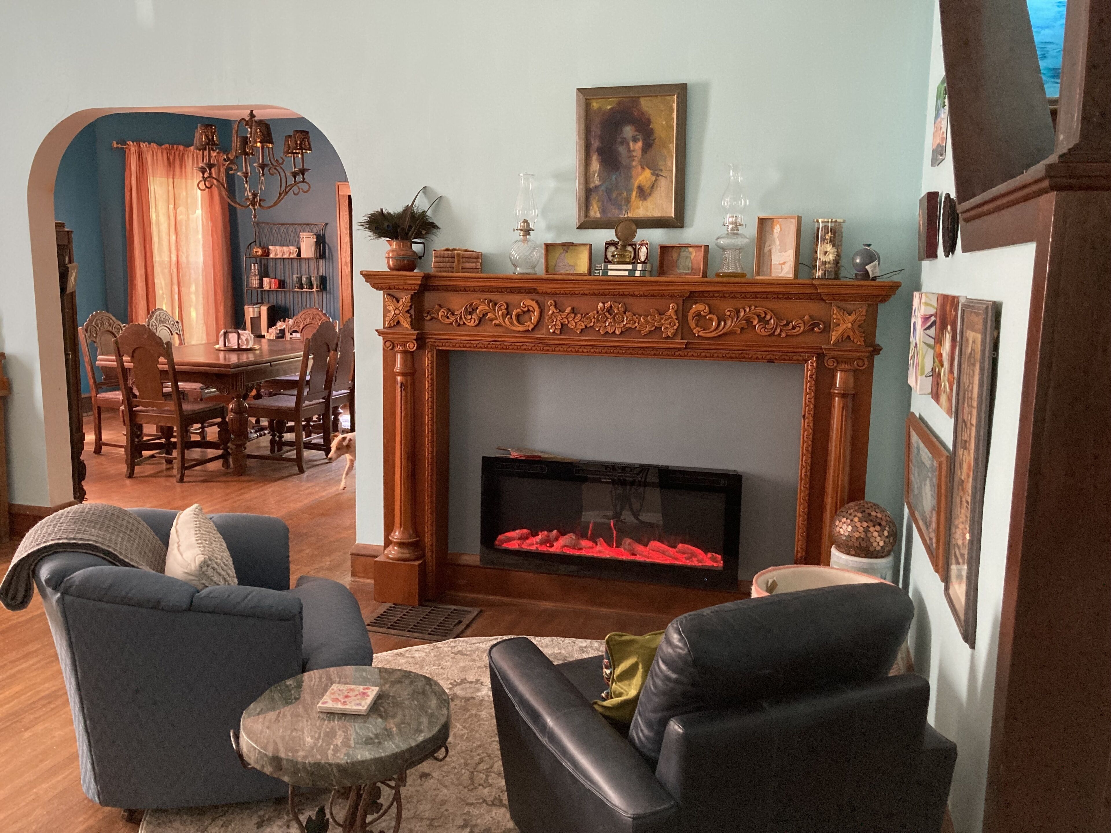 Living room with electric fireplace that plays music from your phone.