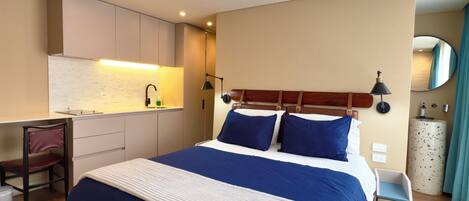 Suite estudio junior | Edredón, minibar, escritorio y wifi gratis