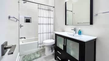 Combined shower/tub, hair dryer, towels, soap